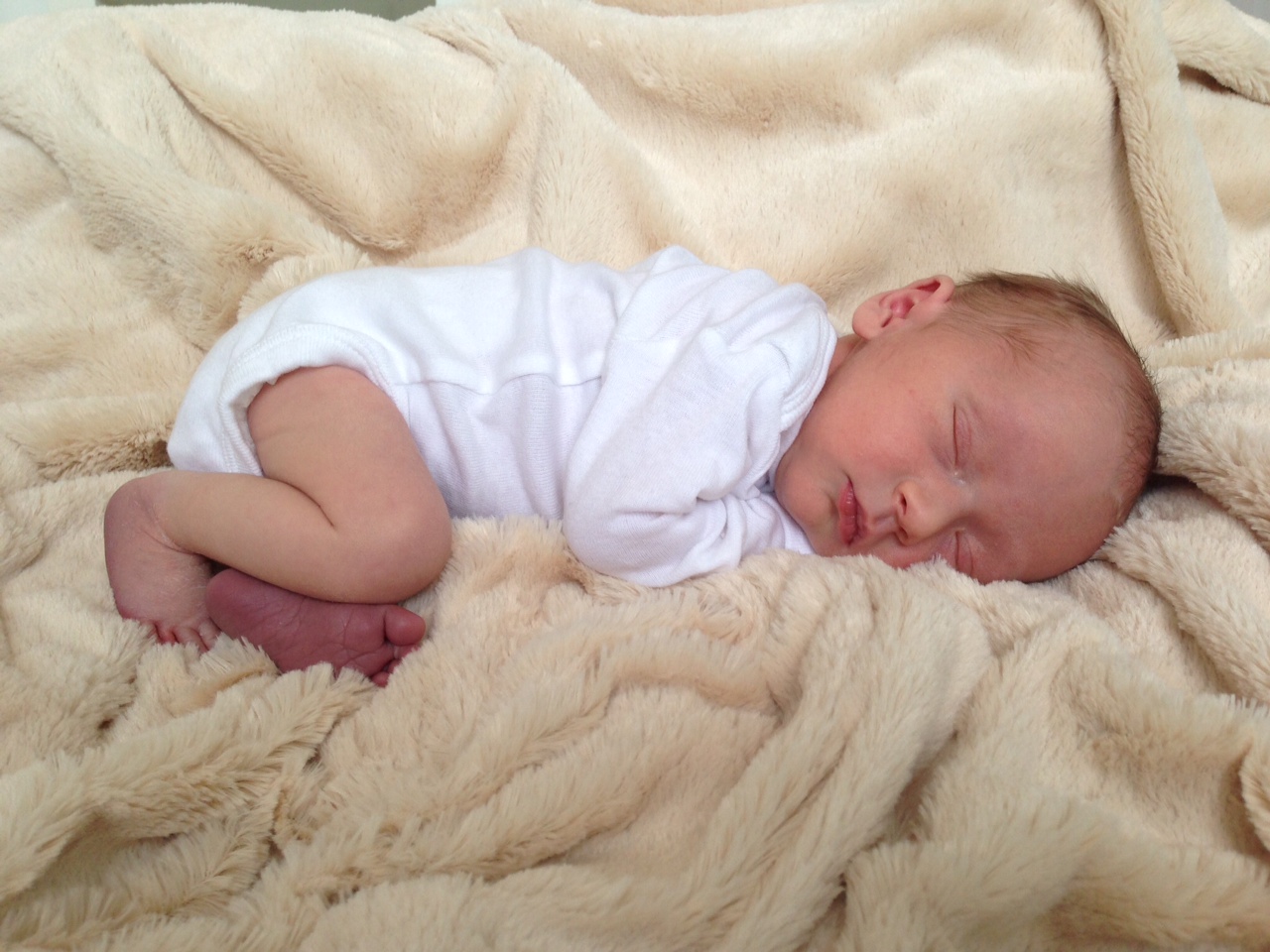 baby sleeping on bamboo blanket