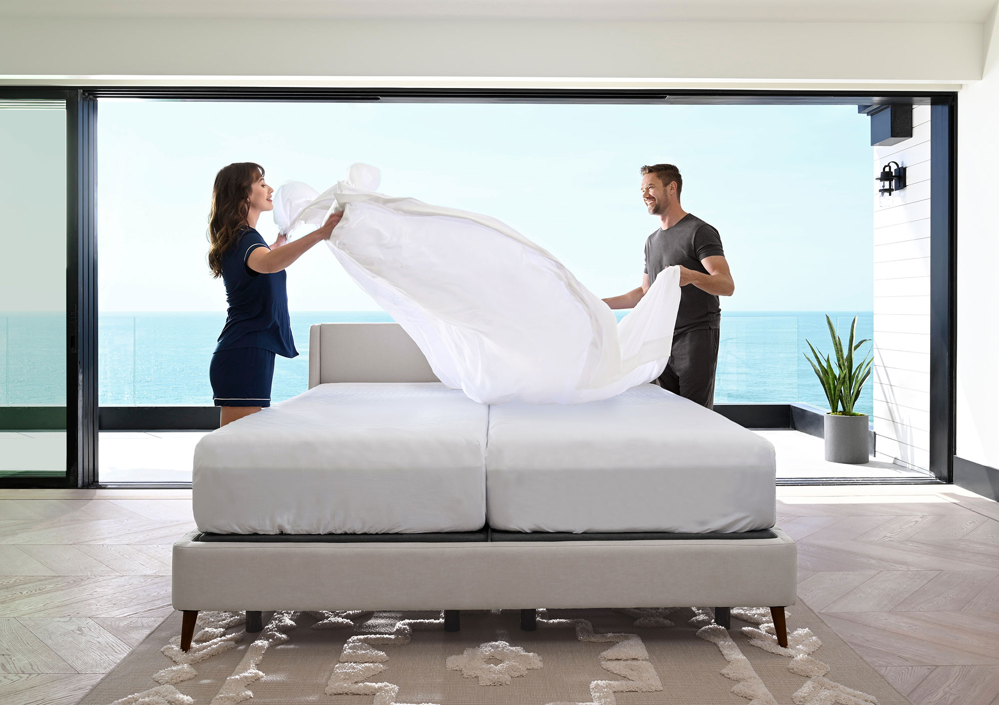 couple making the bed